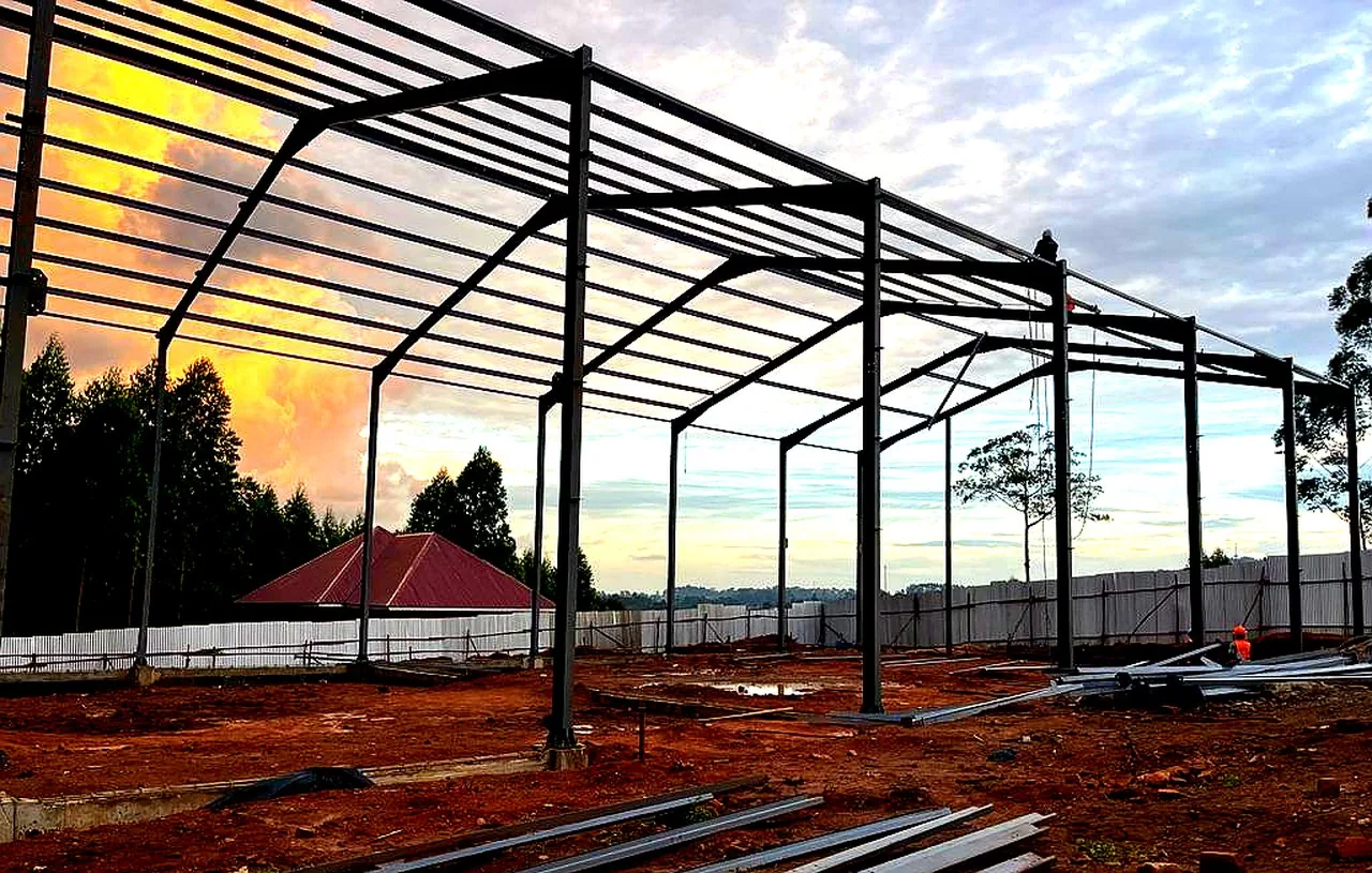 Kareflo Grain Facility — wide-span steel frame at golden hour